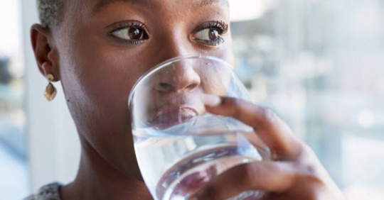 woman drinking glass of water
